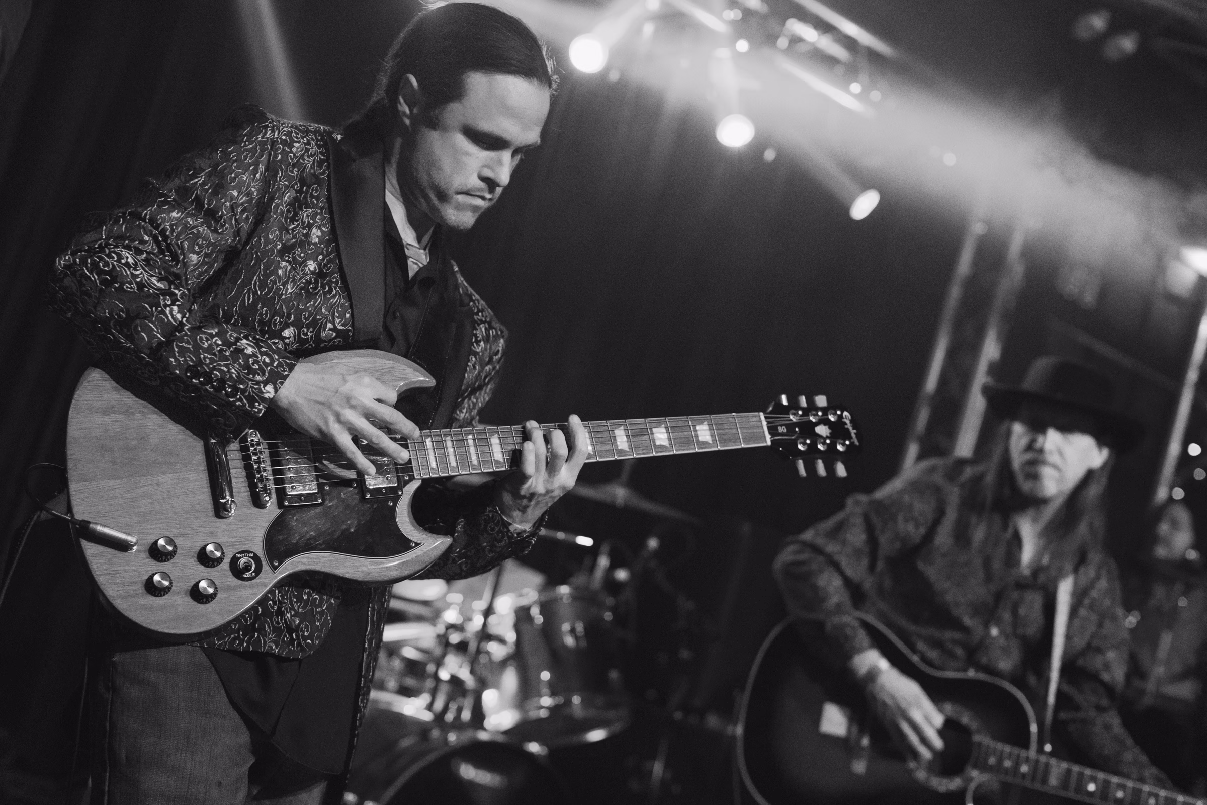 August Kube performs with his band, Swamp Zen, during the 2026 New Year's Eve celebration at Lost on Main. Black and white image