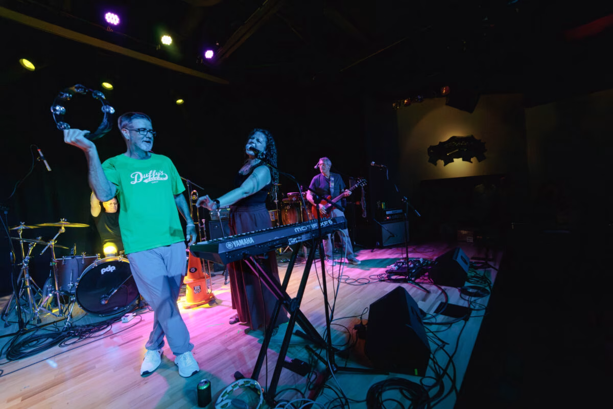 Steve Haws of The Funnels greets the crowd near the end of the set, Big Room.